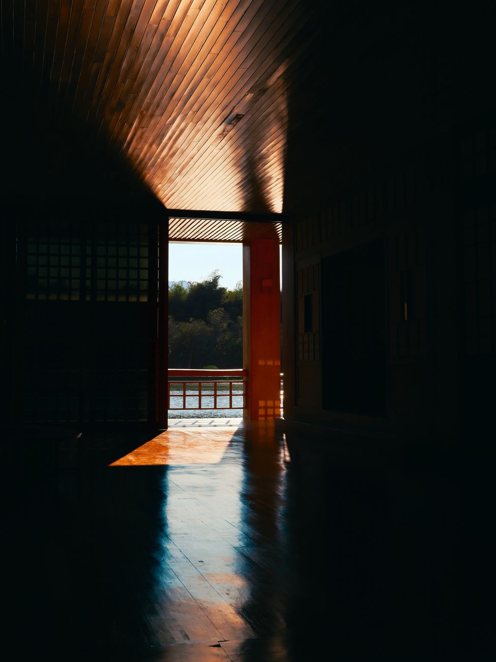 sunlit interior corridor with river view